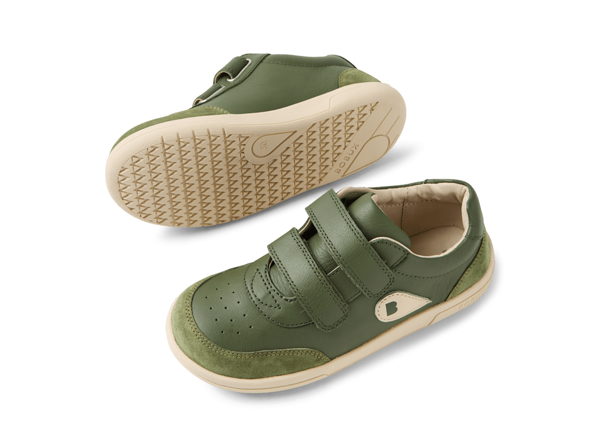 Green children's shoes with velcro straps on a white background