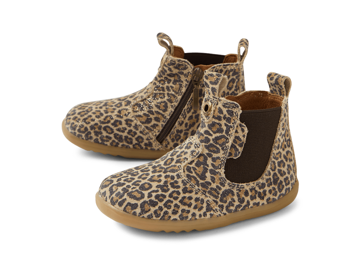 Pair of leopard print boots on a white background