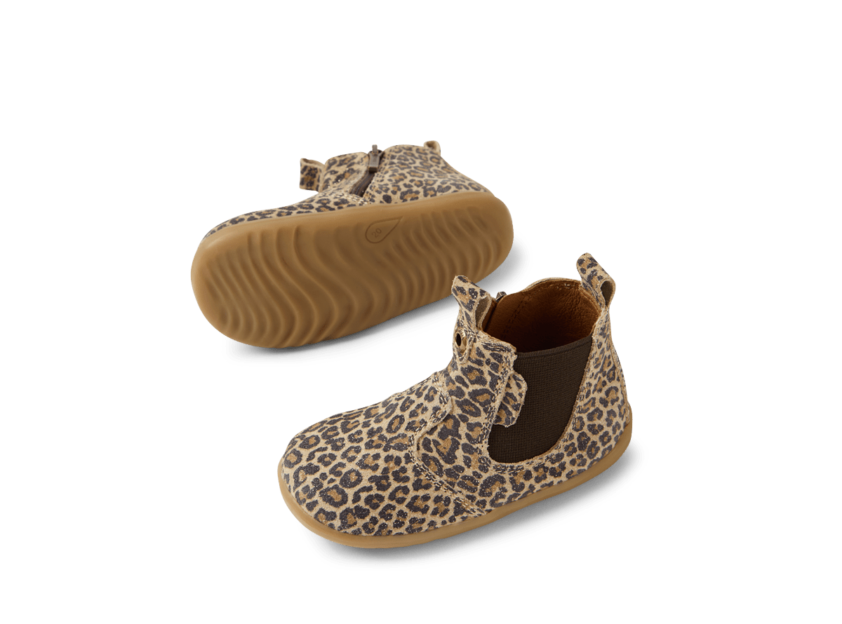 Pair of leopard print baby shoes on a white background