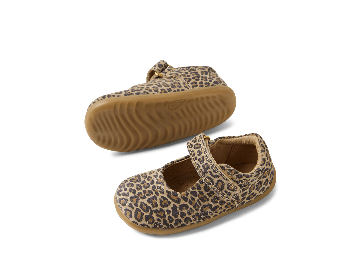Pair of leopard print baby shoes on a white background
