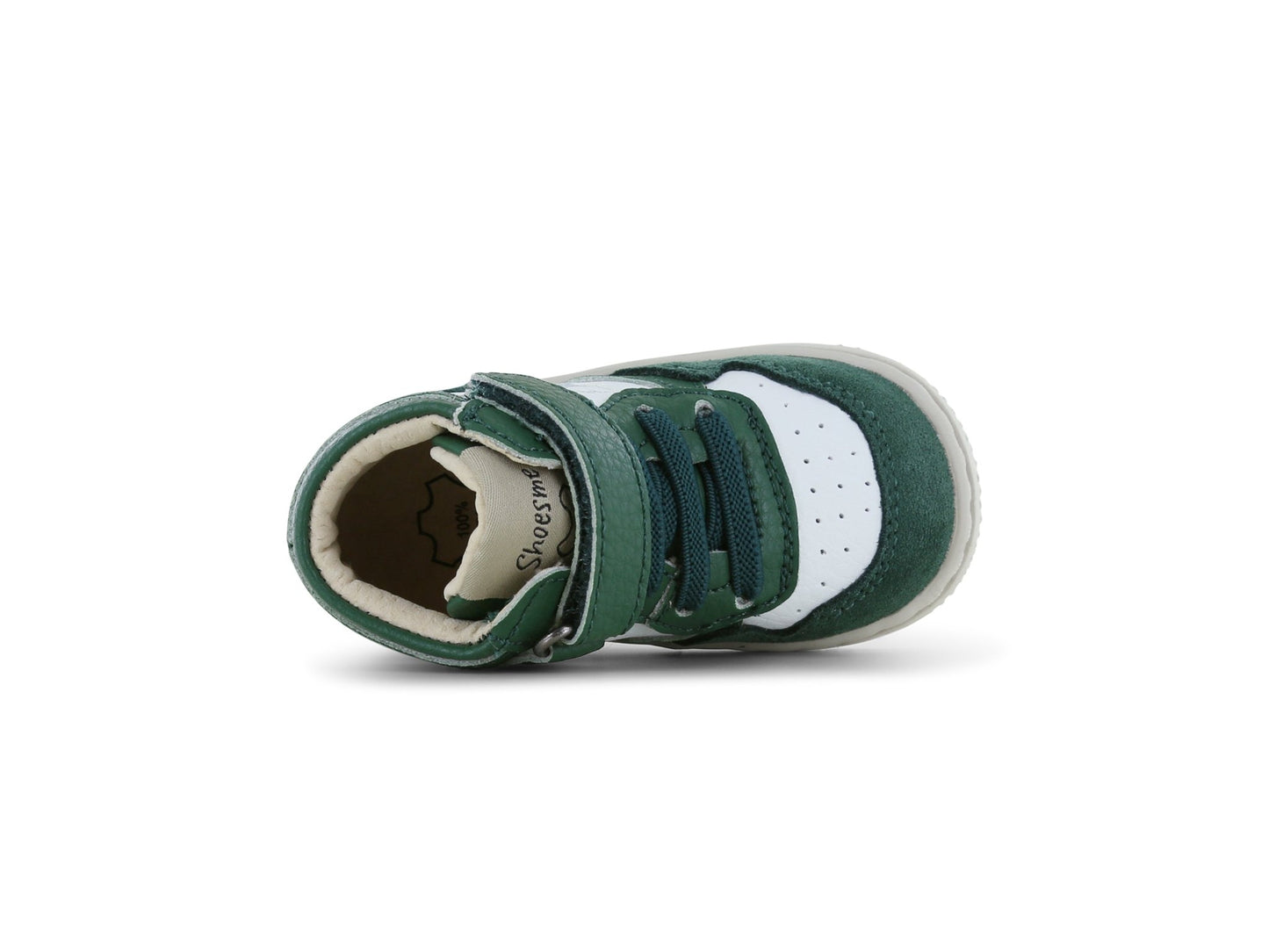 Green and white baby shoe on a white background