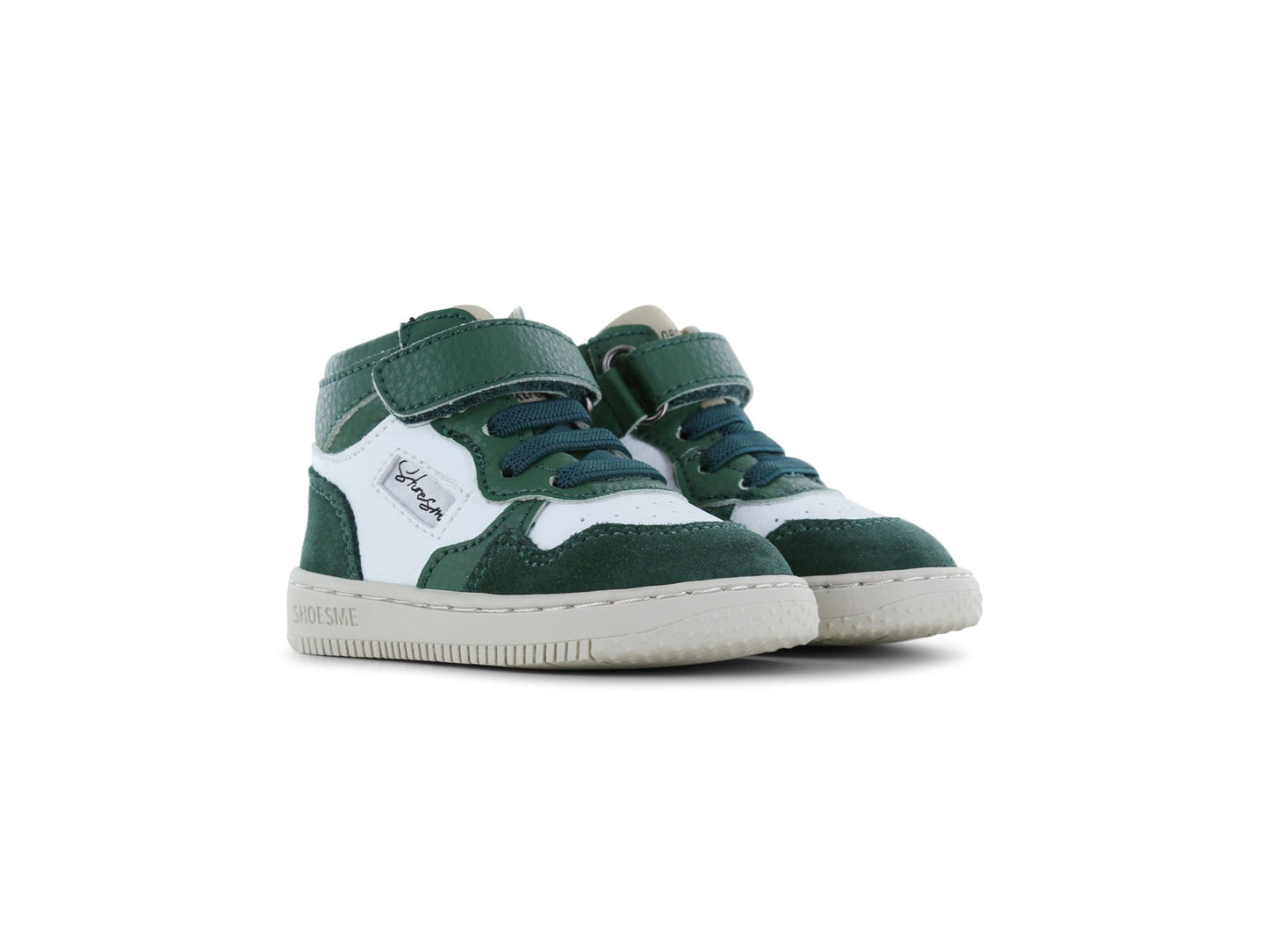 Green and white high-top sneakers on a white background