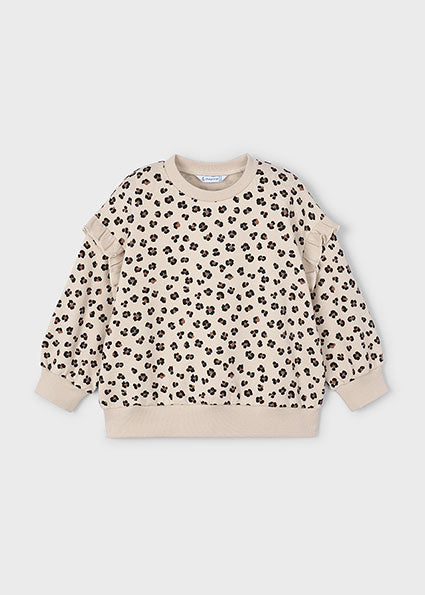 Beige sweatshirt with black leopard print pattern on a light gray background