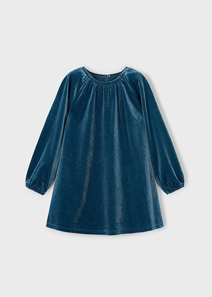 Blue velvet dress on a light grey background