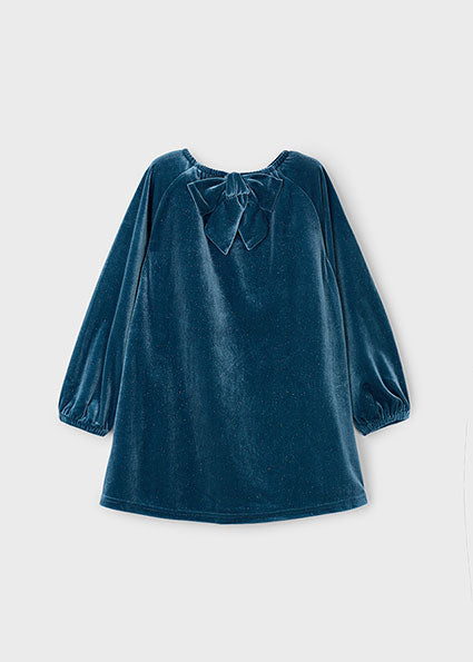 Blue velvet dress with bow detail on a white background