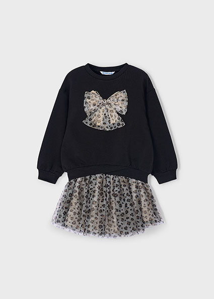 Black sweater with leopard print bow and matching skirt on a light gray background