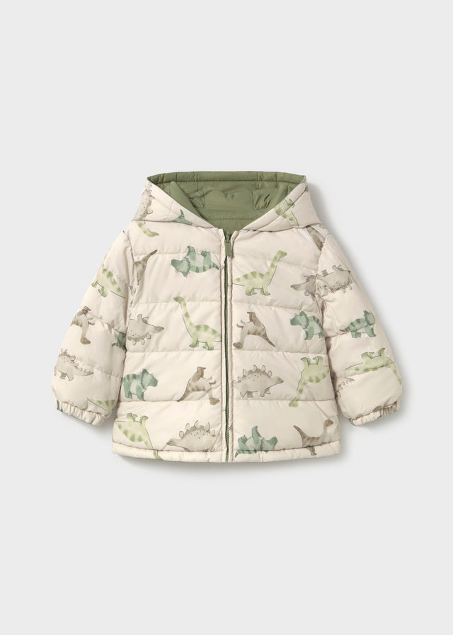 Reversible Bayleaf baby boy hooded coat with quilted green side and cream dinosaur‑print reverse, zip fastening.