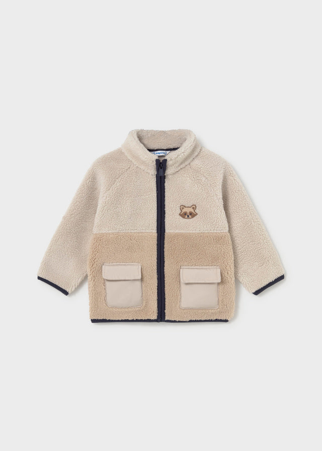 Two‑tone fleece baby boy sweater with zip, flap pockets and embroidered raccoon face.