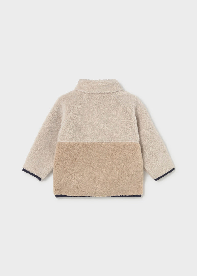 Two‑tone fleece baby boy sweater with zip, flap pockets and embroidered raccoon face.