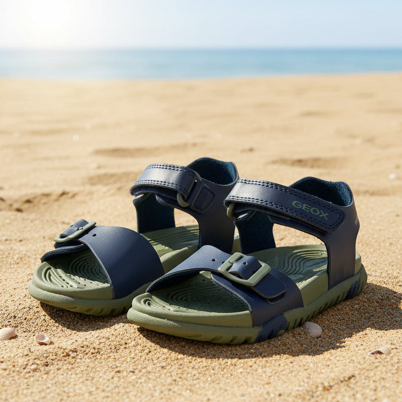 Pair of green and navy sandals with Geox branding on a white background