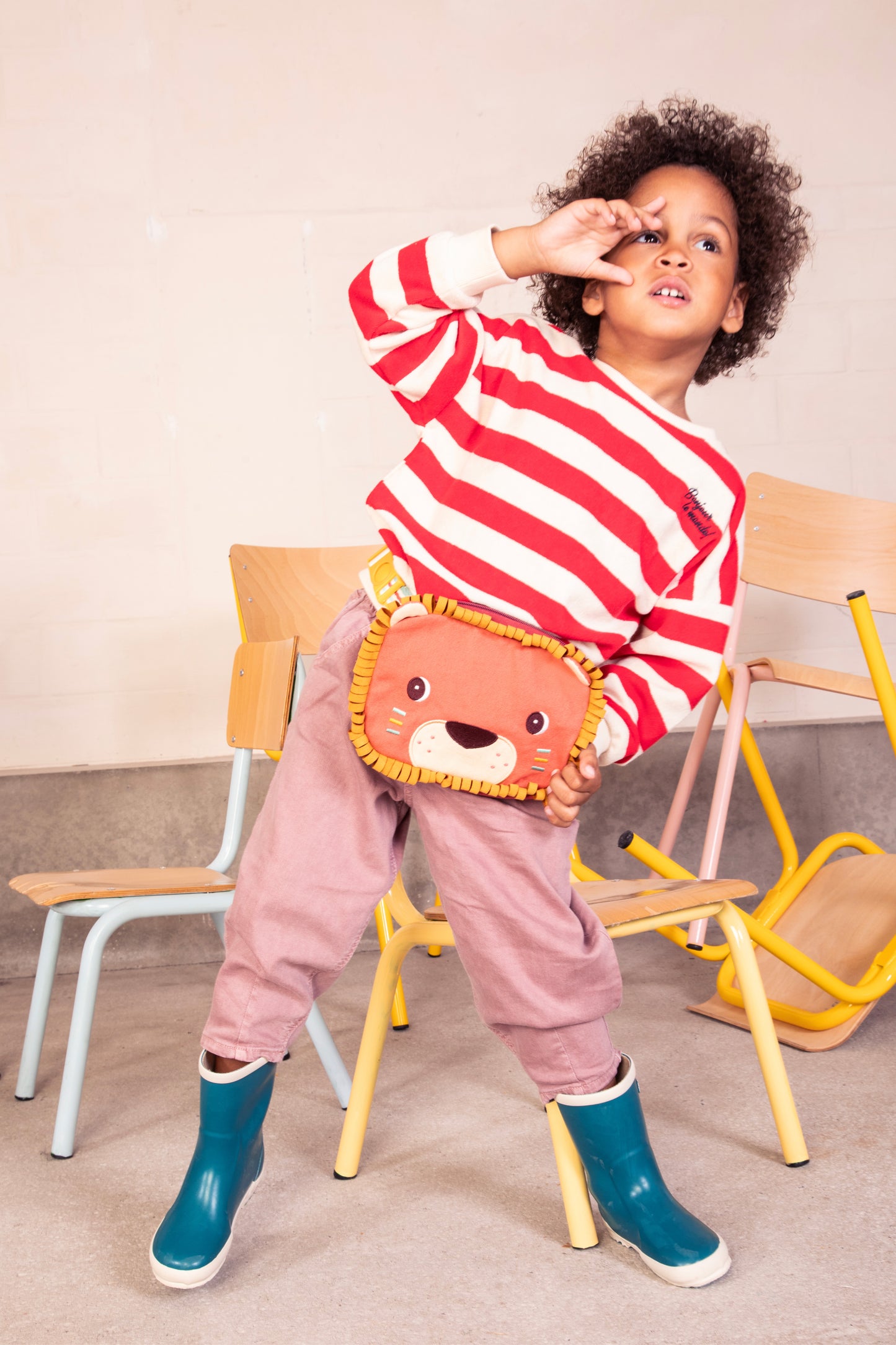 Brave lion‑shaped children’s bumbag with embroidered face, soft whisker mask, looped yellow mane and adjustable strap.
