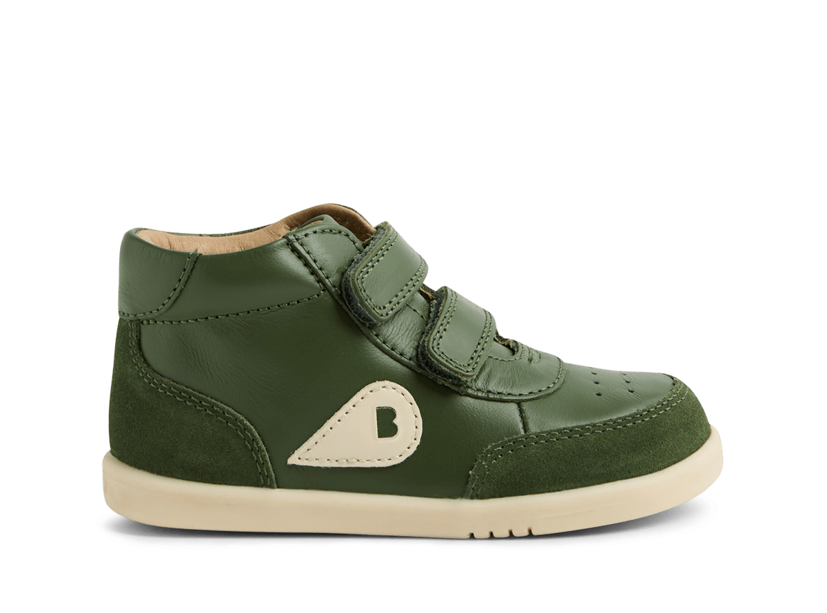 Green children's shoe with a logo on a white background