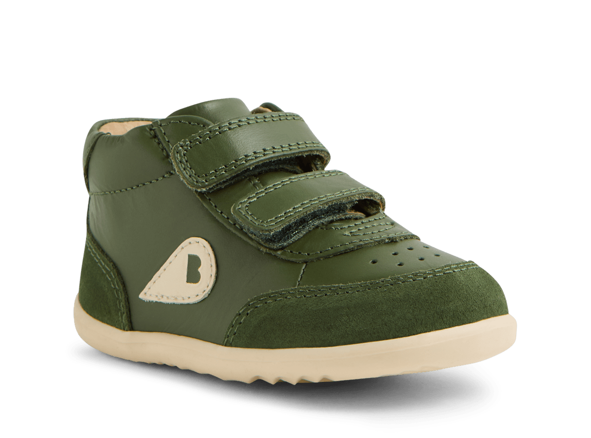 Green children's shoe with a visible brand logo on a white background