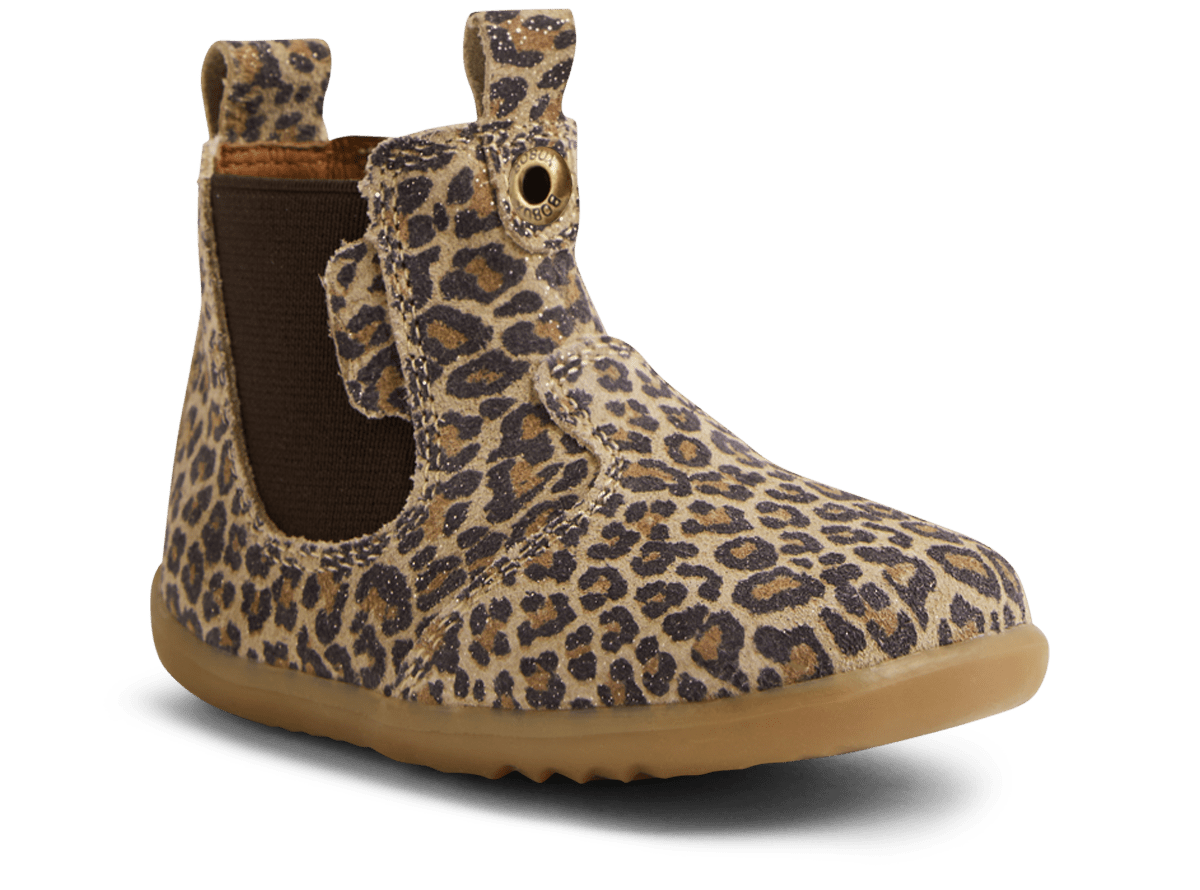 Leopard print baby boot with brown sole on a white background
