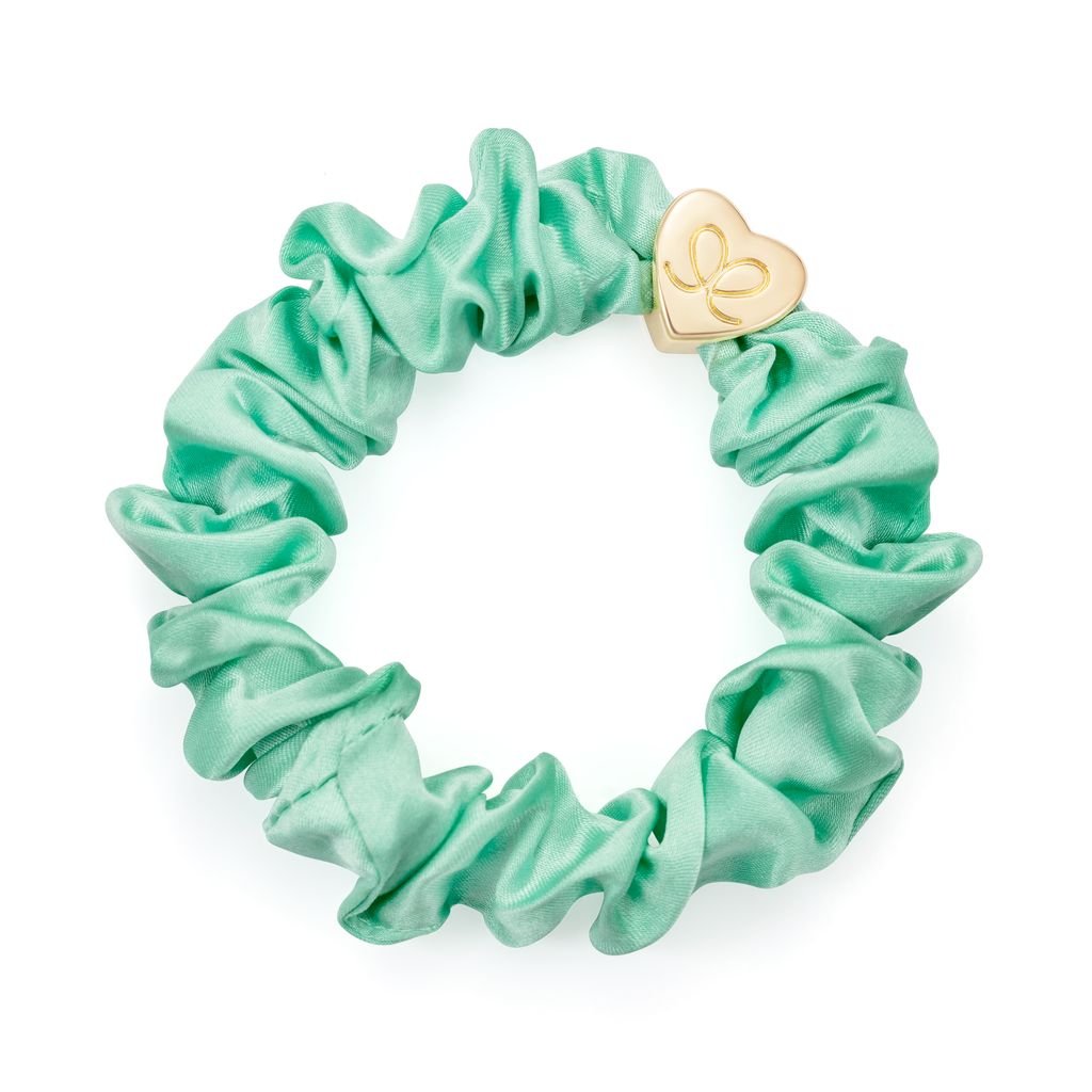 byEloise mint green scrunchie with a gold heart-shaped clip on a white background