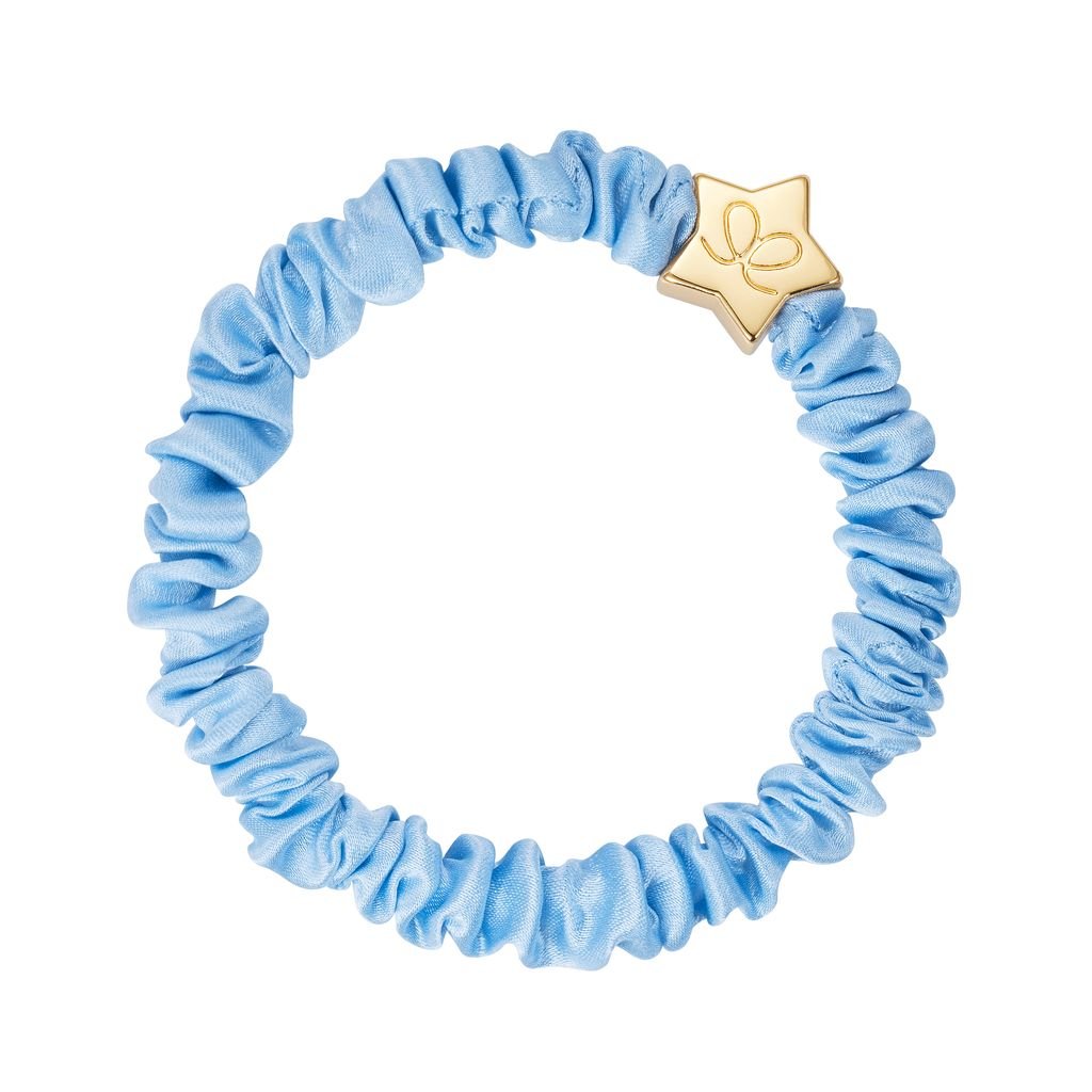 Light blue scrunchie with a gold clasp on a white background
