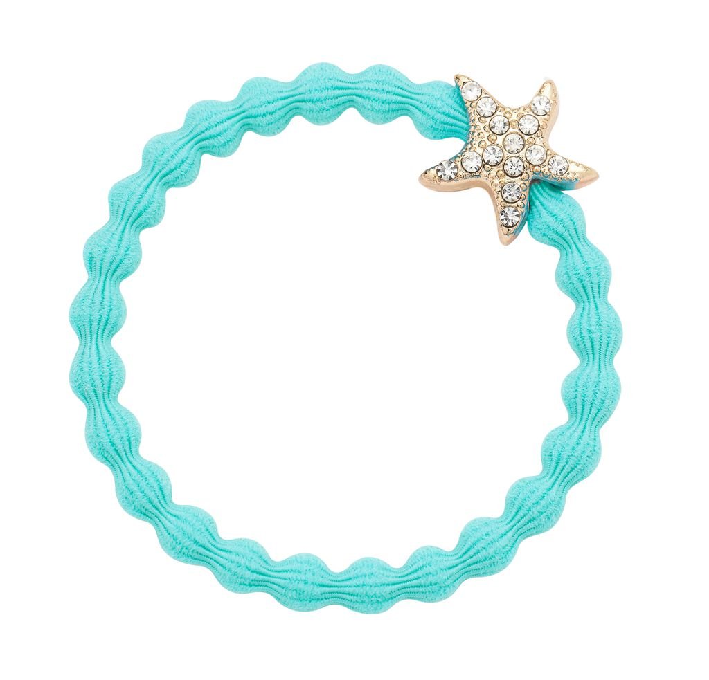 Turquoise hair tie with a star-shaped charm on a white background