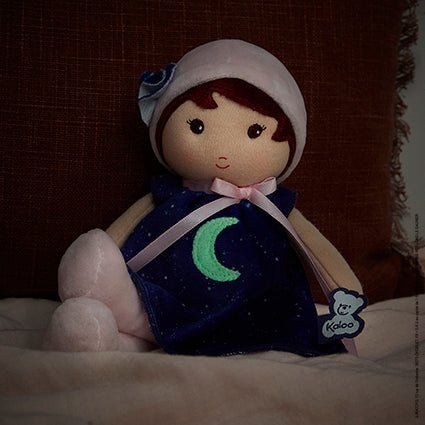 Kaloo | My First Doll - Aurore 25cm , showing how the moon on her dress glows in the dark