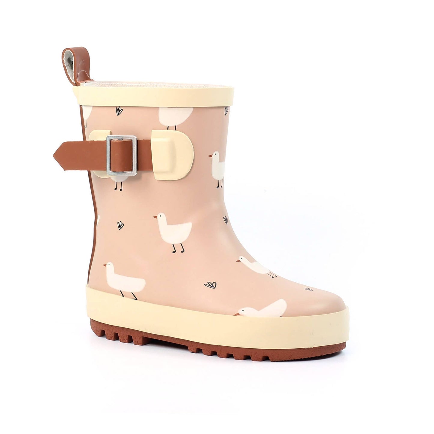 Beige children’s wellington boot with white duck print, cream trim, adjustable side strap, pull tab and textured rubber sole.