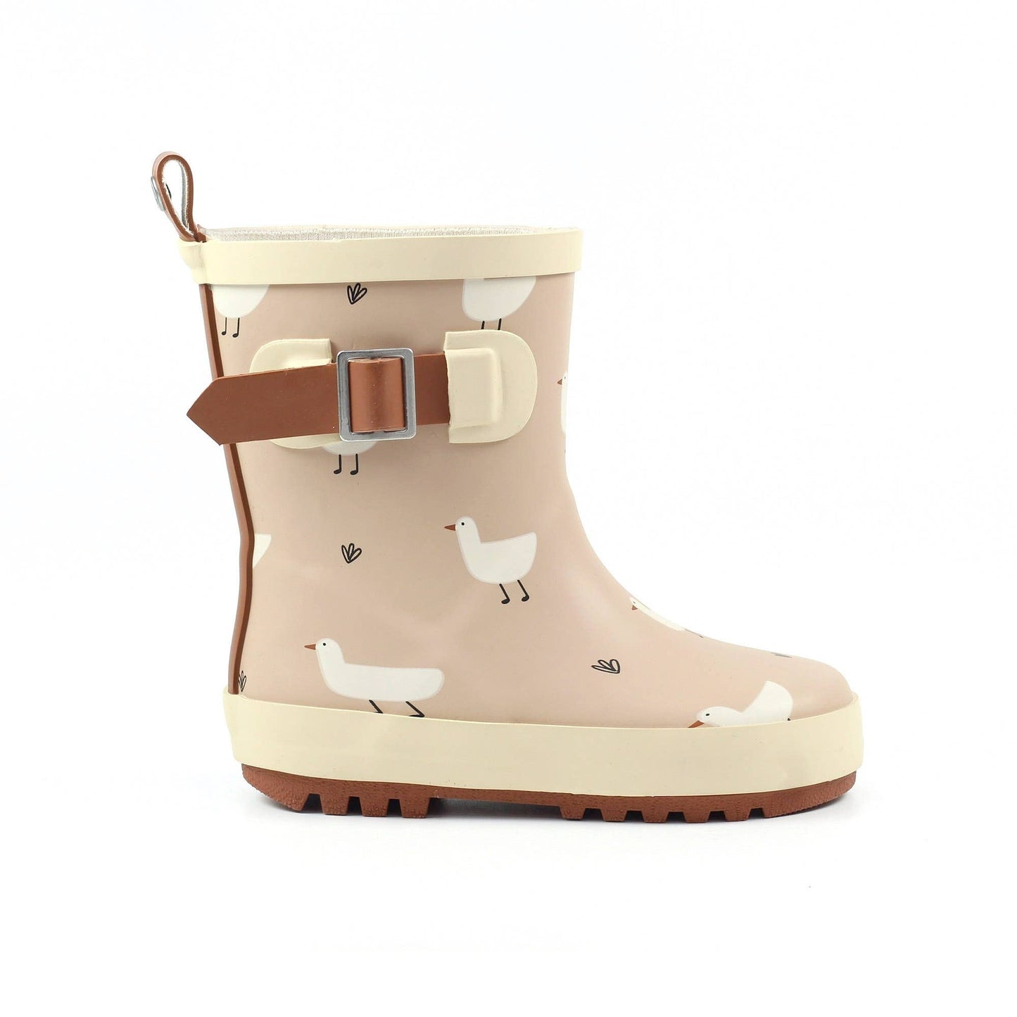 Beige children’s wellington boot with white duck print, cream trim, adjustable side strap, pull tab and textured rubber sole.