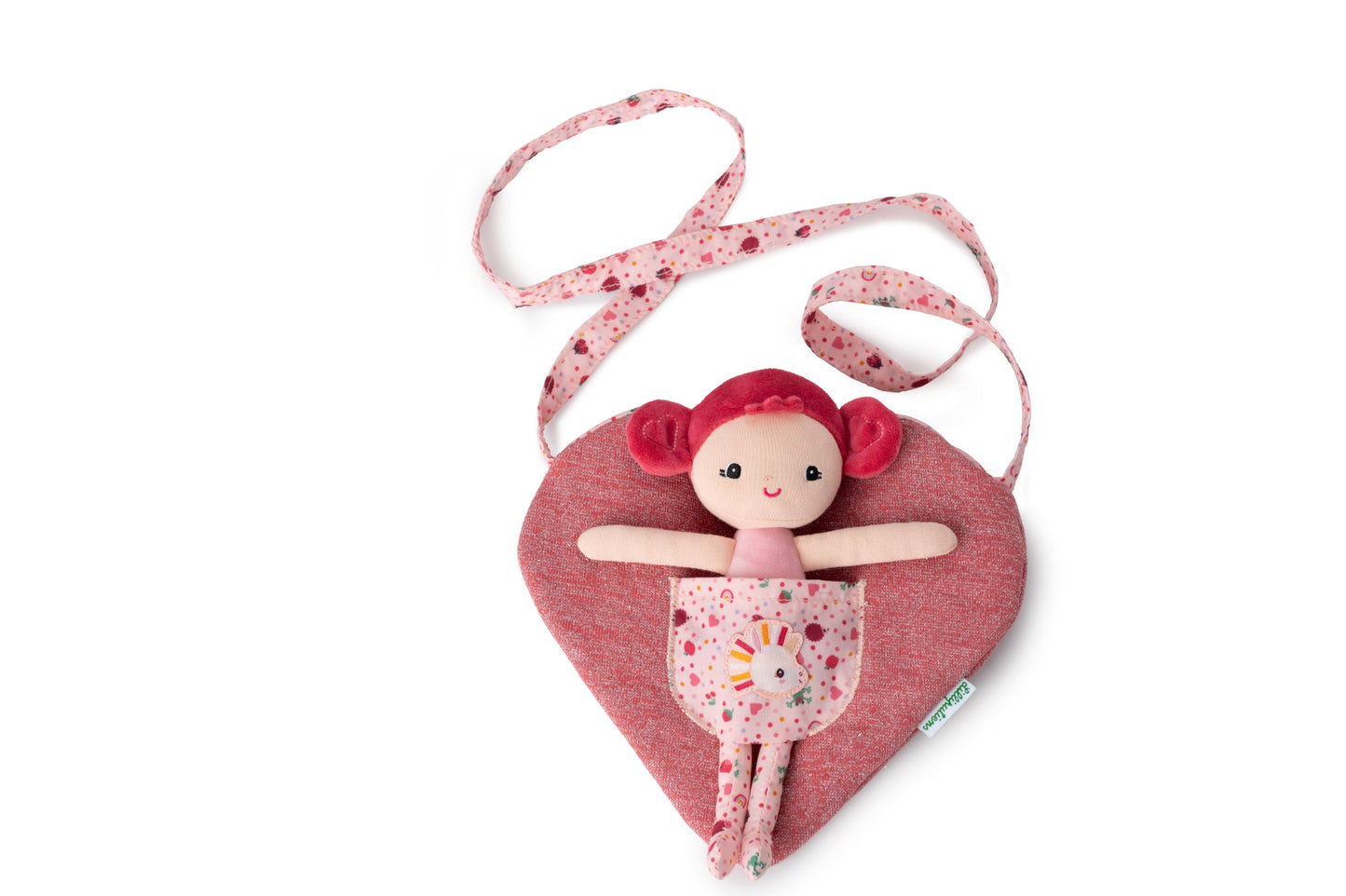 Aline mini fabric doll with deep pink hair, pink top and patterned leggings sitting inside a heart‑shaped children’s bag with unicorn pocket and patterned strap.