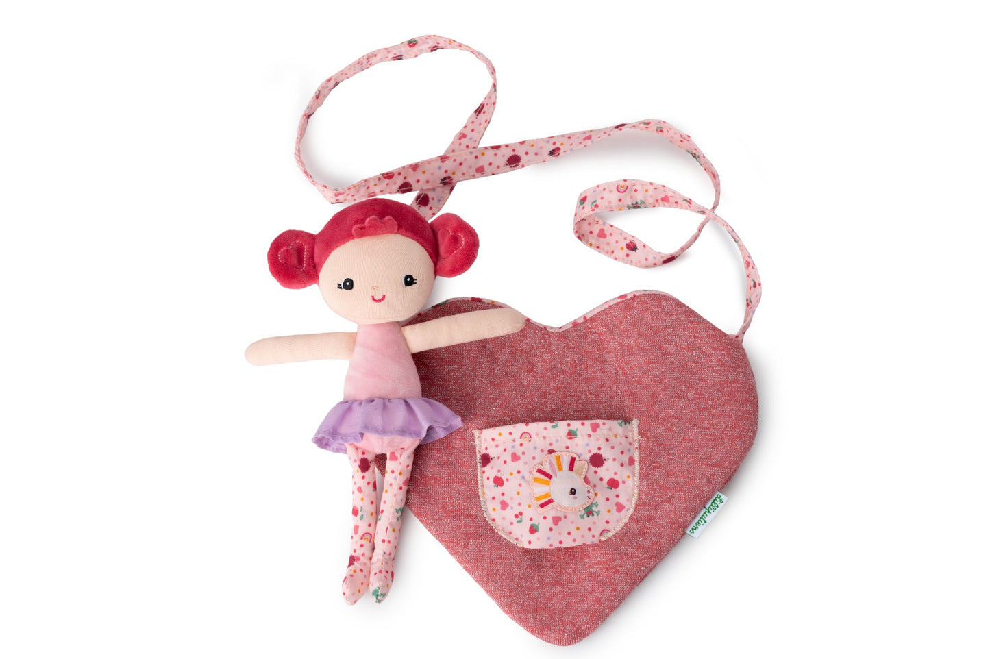 Aline mini fabric doll with deep pink hair, pink top and patterned leggings sitting inside a heart‑shaped children’s bag with unicorn pocket and patterned strap.