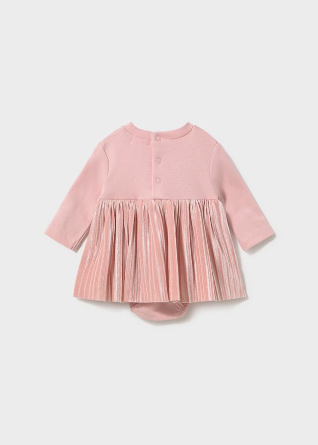 A baby girl's long-sleeve dress in dusty pink, featuring a solid knit bodice with three front buttons and a pleated tulle skirt, shown flat on a light gray background.