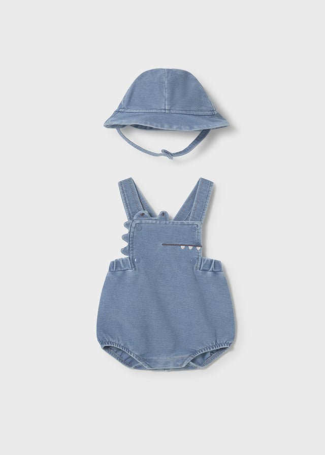 Blue baby dinosaur romper with playful spikes and matching wide‑brim sun hat.