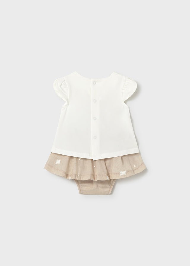 Baby girl teddy‑bear t‑shirt with puff sleeves and beige frill‑skirt and built in bloomers.