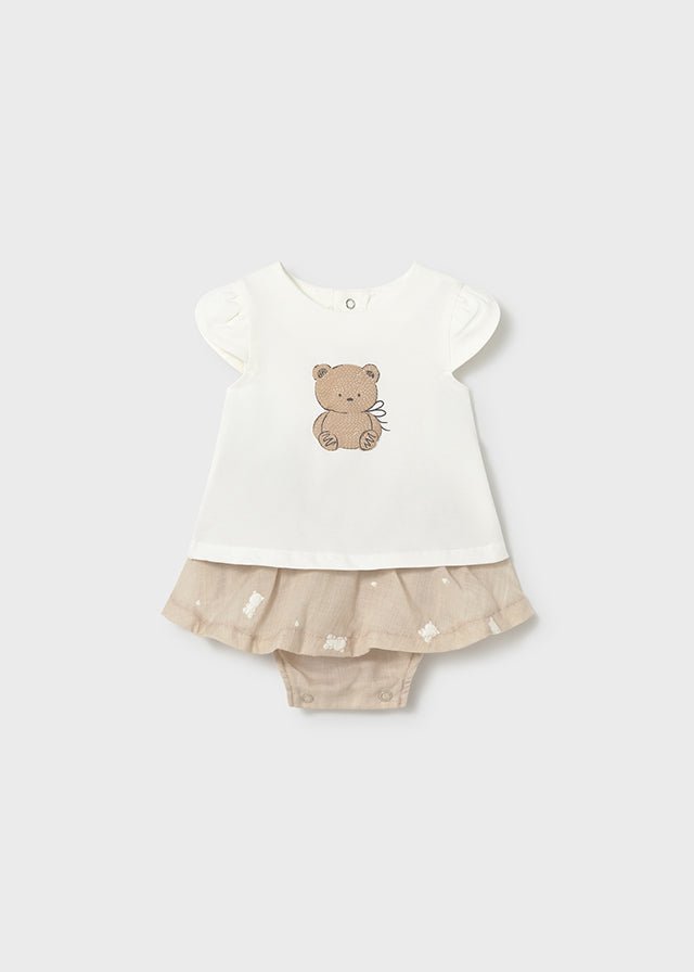 Baby girl teddy‑bear t‑shirt with puff sleeves and beige frill‑skirt and built in bloomers.