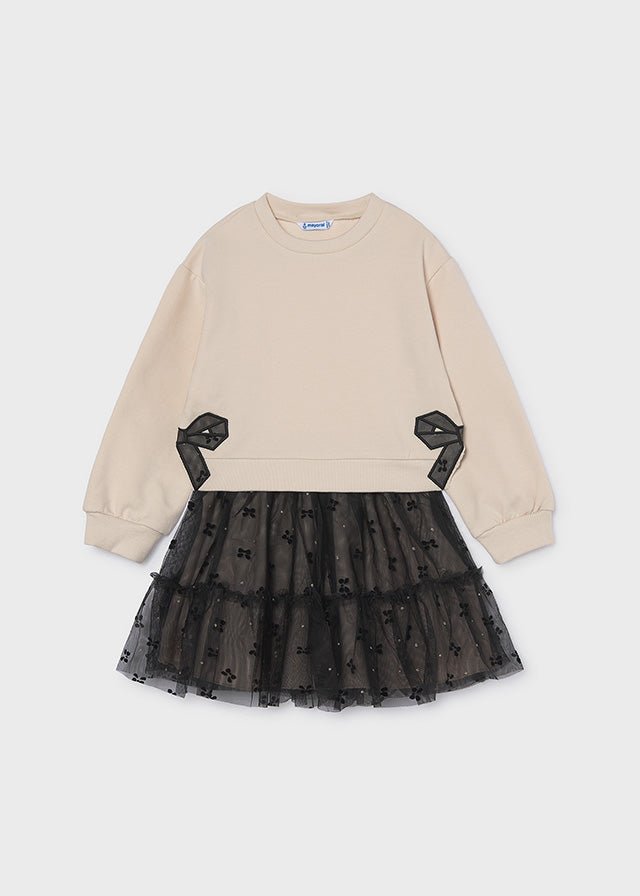 Beige pullover with black bow detail and attached layered black embroidered tulle skirt, Style 16‑04934‑062.