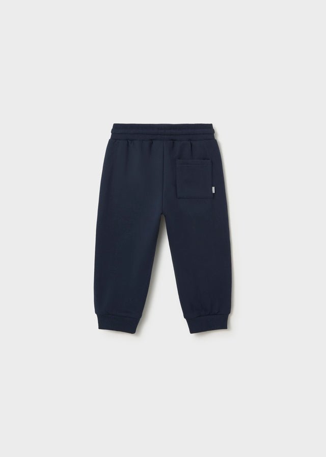 Blue fleece trousers for babies and toddlers with elastic waistband, drawstring and ribbed cuffs.