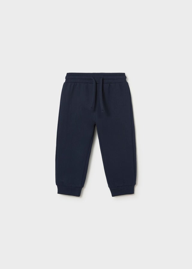 Blue fleece trousers for babies and toddlers with elastic waistband, drawstring and ribbed cuffs.