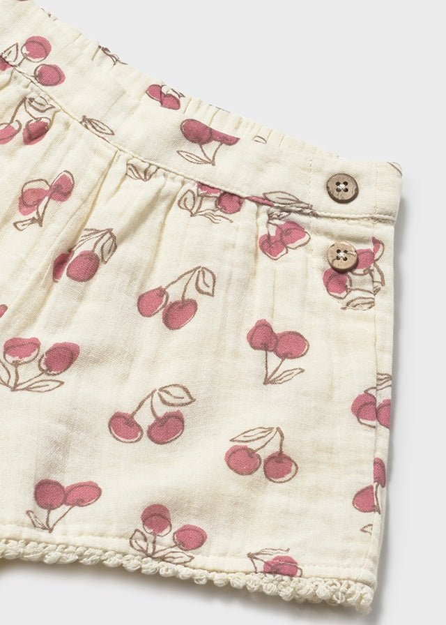 Mayoral Cherry print beige cotton shorts with decorative button design to the stretch waist band. 