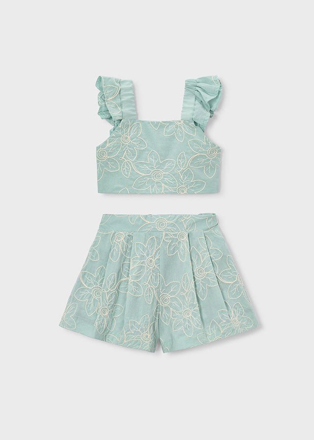 Turquoise floral crop top with ruffled straps and pleated shorts for girls.