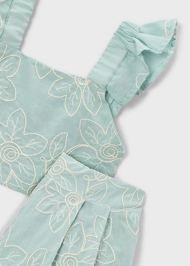Turquoise floral crop top with ruffled straps and pleated shorts for girls.