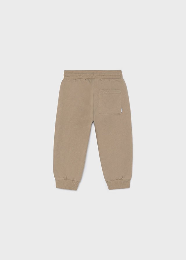 Hazelnut fleece trousers for babies and toddlers with elastic waistband, drawstring and ribbed cuffs.