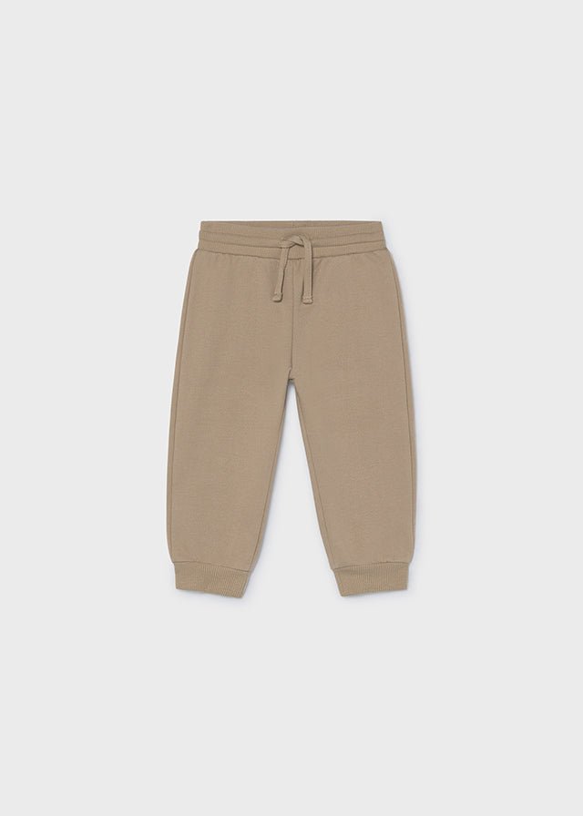 Hazelnut fleece trousers for babies and toddlers with elastic waistband, drawstring and ribbed cuffs.