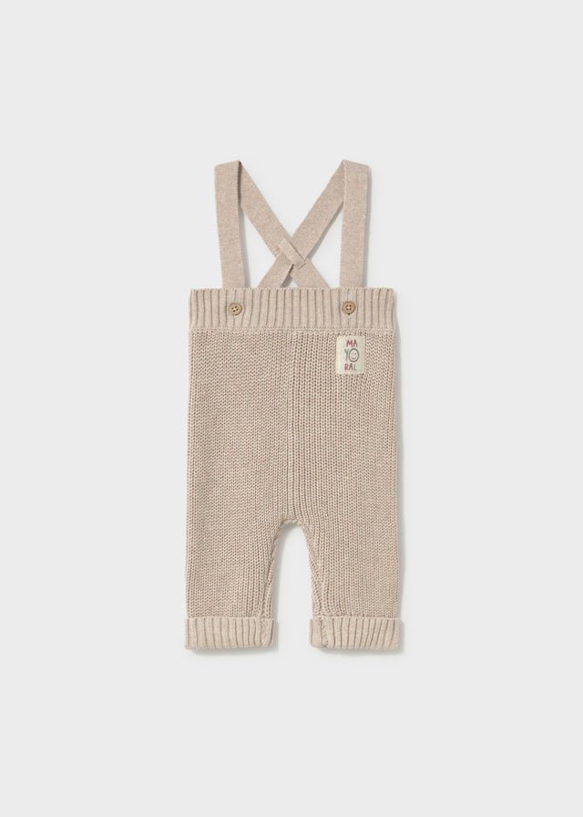 Mayoral baby knit suspenders pants in stone — soft cotton trousers with cross‑over straps and button detail.