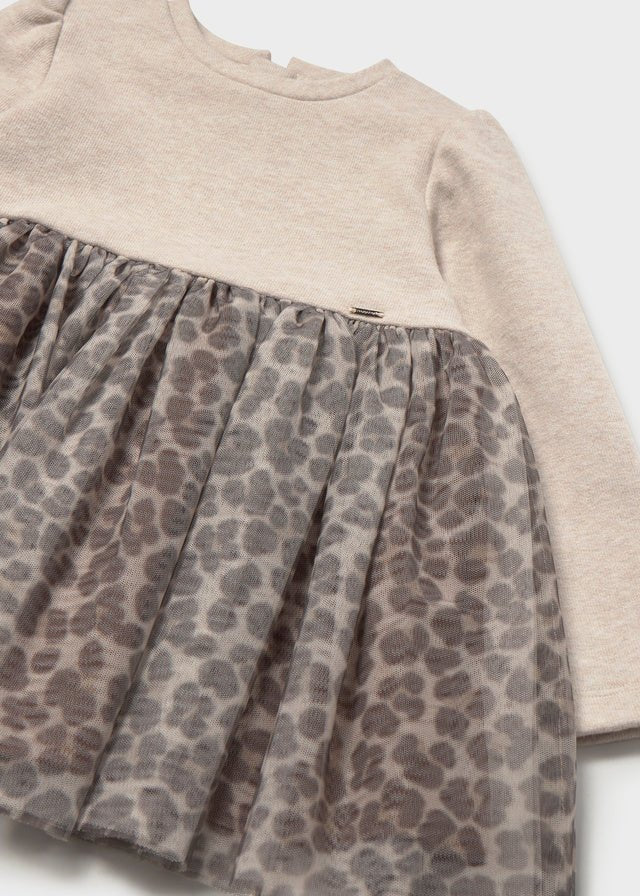 Baby girl knit‑and‑tulle dress with seed‑tone top and leopard‑print tulle skirt.

