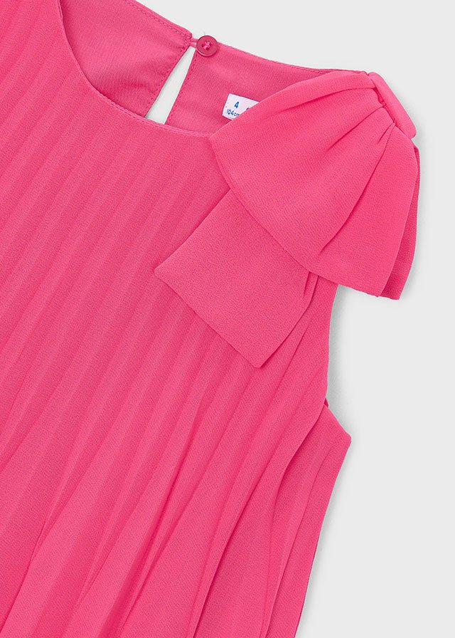 Girls’ bright pink pleated dress with bow‑shoulder detail, sleeveless and lightweight.