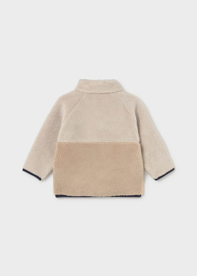 Two‑tone fleece baby boy sweater with zip, flap pockets and embroidered raccoon face.