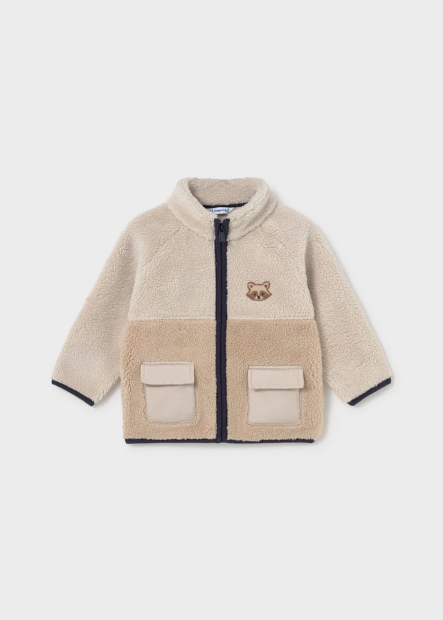 Two‑tone fleece baby boy sweater with zip, flap pockets and embroidered raccoon face.