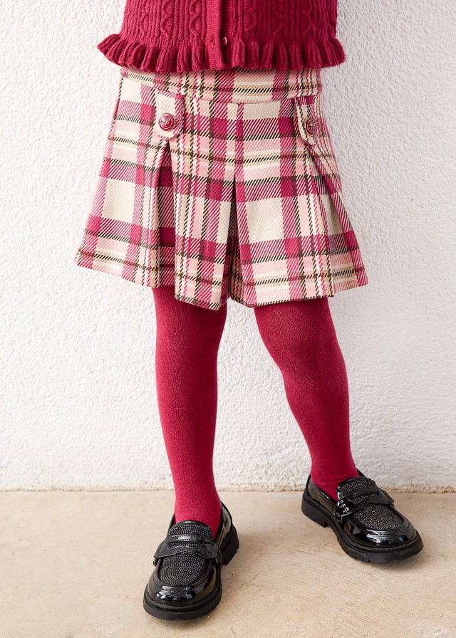 Raspberry plaid shorts with front buttons and pleats.