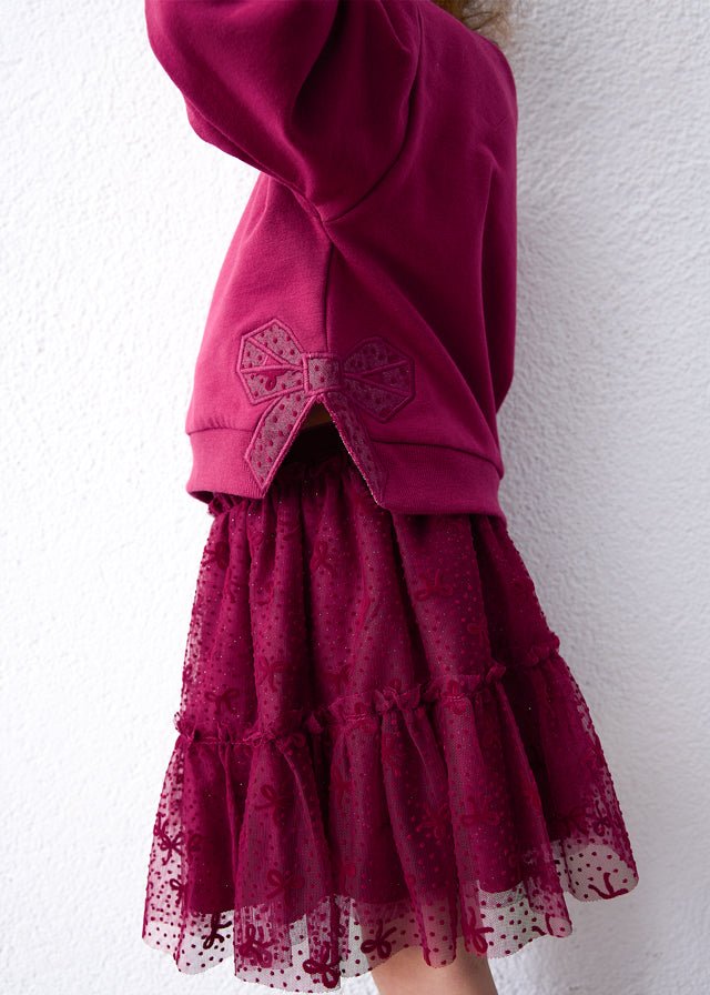 Raspberry two‑piece set with long‑sleeve pullover and layered dotted tulle skirt, Style 16‑04934‑060.