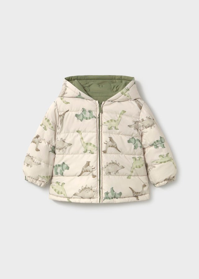 Reversible Bayleaf baby boy hooded coat with quilted green side and cream dinosaur‑print reverse, zip fastening.