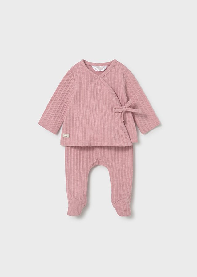 Baby girl pink ribbed wrap top with matching footed pants.