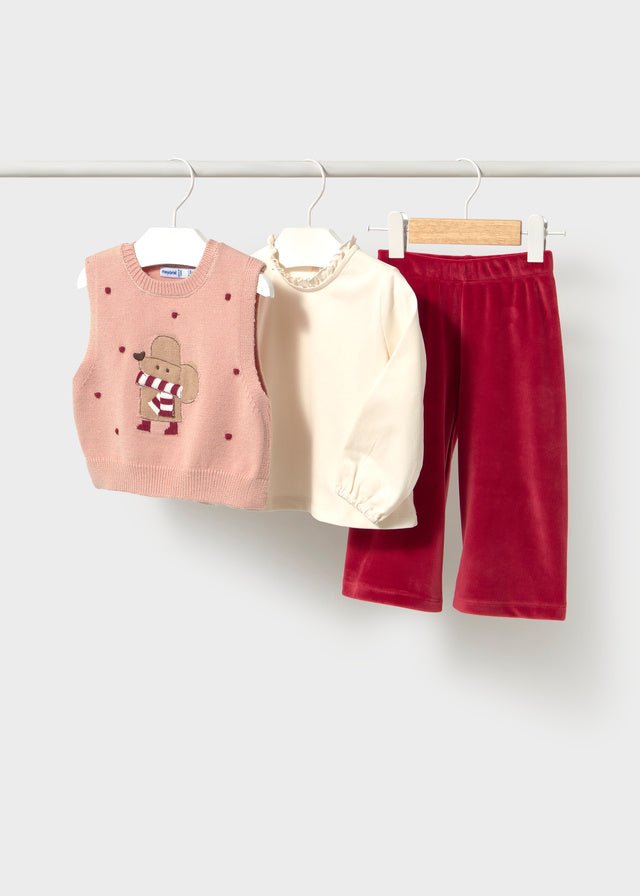 Baby girl three‑piece outfit with cream long‑sleeve top, Rooibos Tea trousers and pink knit vest featuring a mouse motif.

