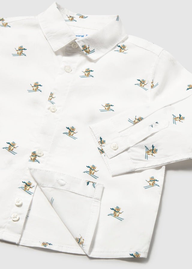 Baby Boy white long sleeve buttondown shirt with skier print and collar.