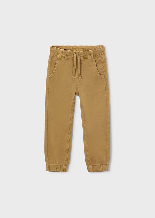 Cookie‑coloured soft jogger pants with drawstring waist, cuffed ankles and pockets, Style 16‑04511‑063.